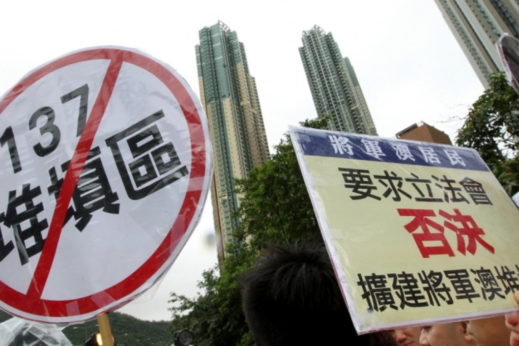 Residents of Tseung Kwan O protest stage a protest against the plan of extending landfill in the district and urge the government to close it during a parade in Tseung Kwan O. Photo: May Tse