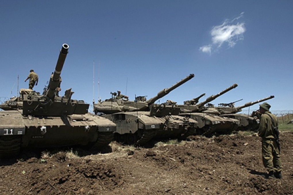 Merkava tanks are stationed in the Israeli annexed Golan Heights near the border with Syria. Photo: AFP
