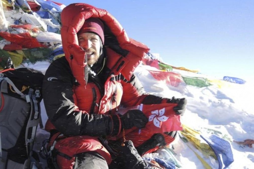 Hong Kong-based climber Paul Niel, 34, celebrates with Bauhinia flag on the summit of Mount Everest, 60 years after the first ascent by Edmund Hillary and Tenzing Norgay. Niel became only the ninth person to scale Everest and Lhotse, the fourth highest peak, within 24 hours, in an expedition that had its share of tragedy. Photo: SCMP