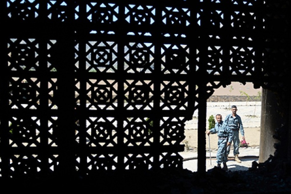 Afghan defence personnel inspect the scene following a suicide attack in Bazarak district, Panjshir province, on Wednesday. Photo: AFP