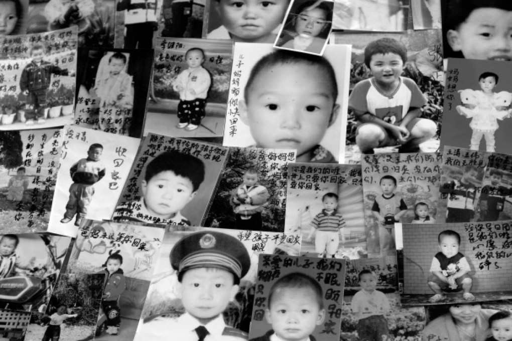 Mothers leave messages written on the photos of young boys that have been taken from them. Photo: Richard Jones/Sinopix