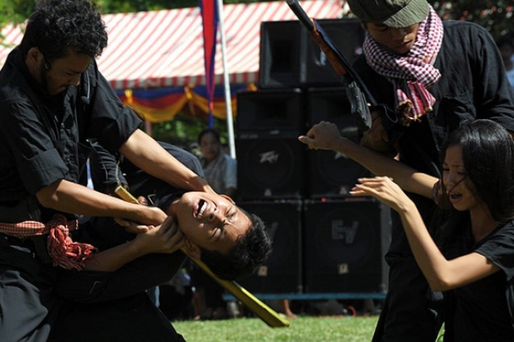 Cambodian students mark the annual 'Day of Anger' at a killing fields memorial. Photo: AFP