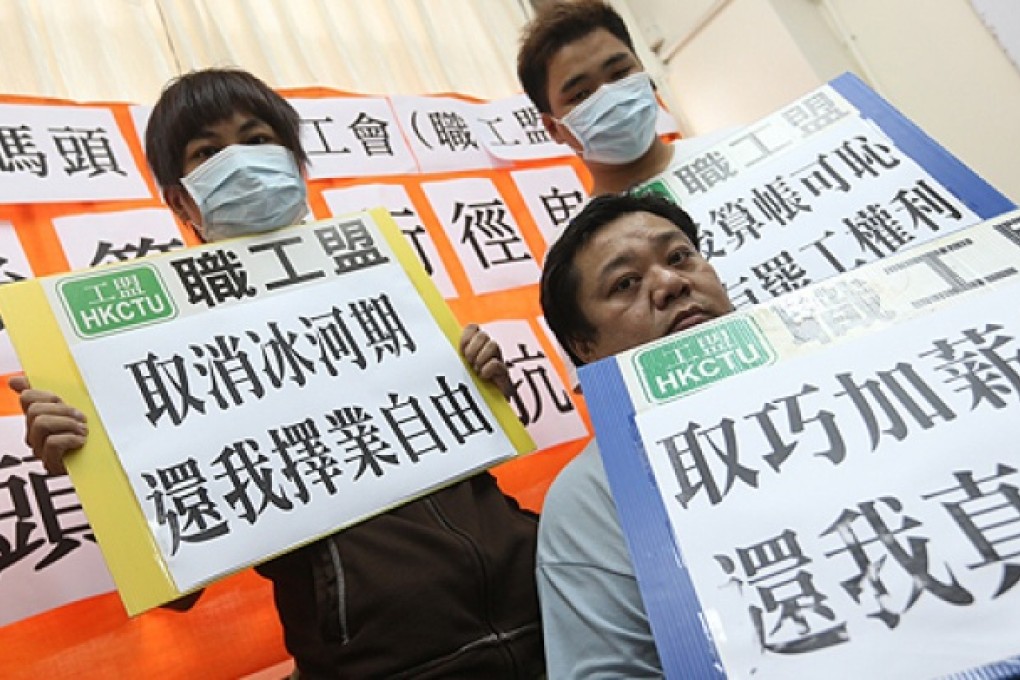 Two sacked workers - (back row, from left) Mr Ng and Wong Kin-ming - and another Pui Kee employee, Ho Yik-wing (front). Photo: Sam Tsang