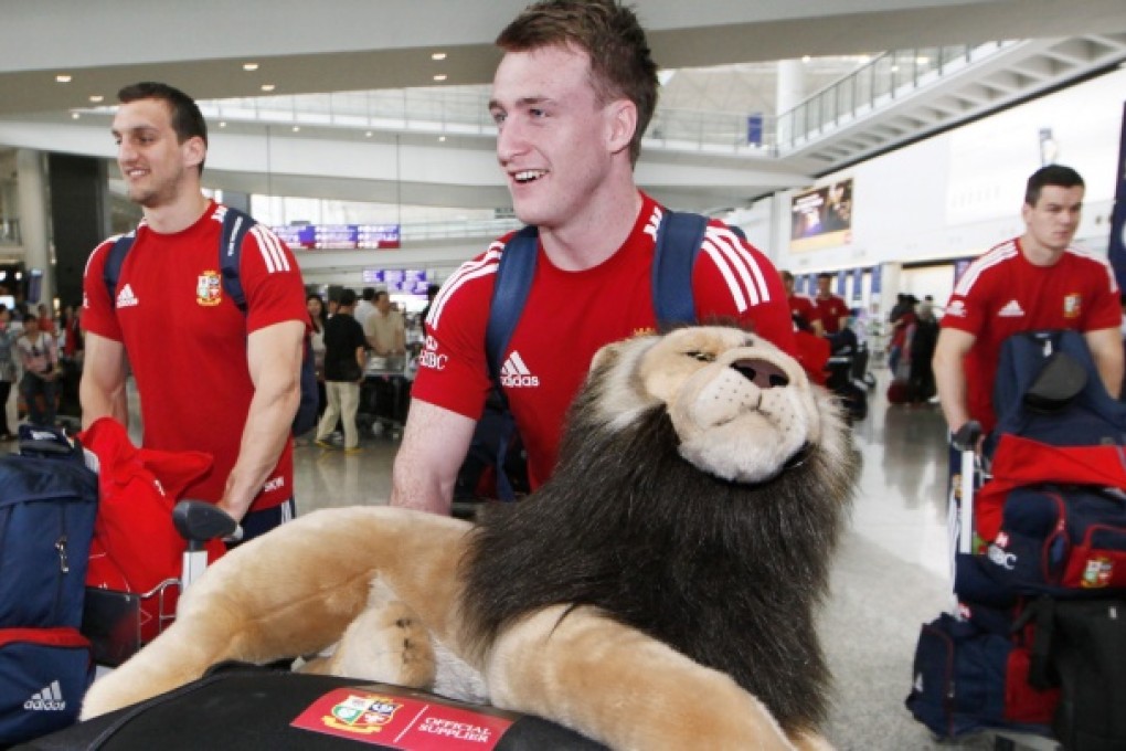 The Lions arrived in Hong Kong yesterday for Saturday's encounter with the Barbarians, but without their travelling horde of fans. Photo: Reuters