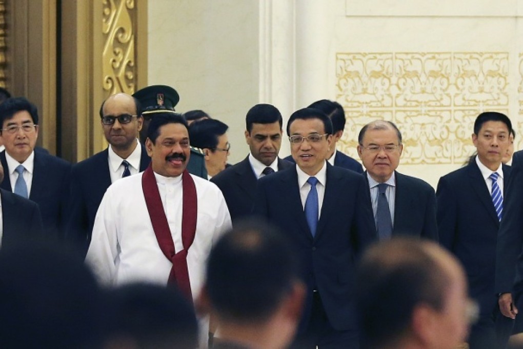 Premier Li Keqiang and Sri Lanka President Mahinda Rajapaksa arrive at Beijing International Fair for Trade in Services in Beijing, May 29, 2013. Photo: Reuters