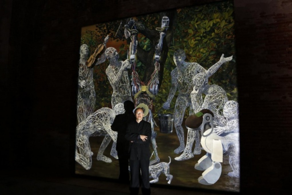 Artist Miao Xiaochun poses near his installation Transfiguration during the 55th Venice Biennale. Photo: Reuters