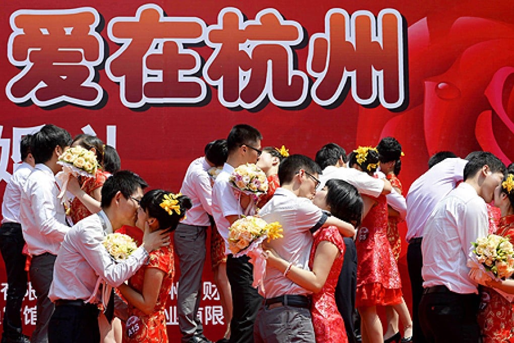 Couples find marital bliss at a mass wedding in Hangzhou, but others may need some help. Enter: Seek-a-Husband training. Photo: Reuters
