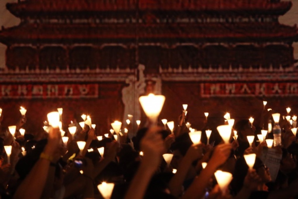 Tens of thousands of people take part in a candlelight vigil at Victoria Park to mark the 23rd anniversary of the military crackdown of the pro-democracy movement at Beijing's Tiananmen Square in 1989. Photo: Sam Tsang