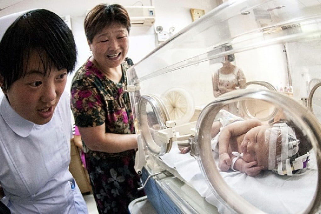 'Baby No 59' after his rescue. Photo: Reuters
