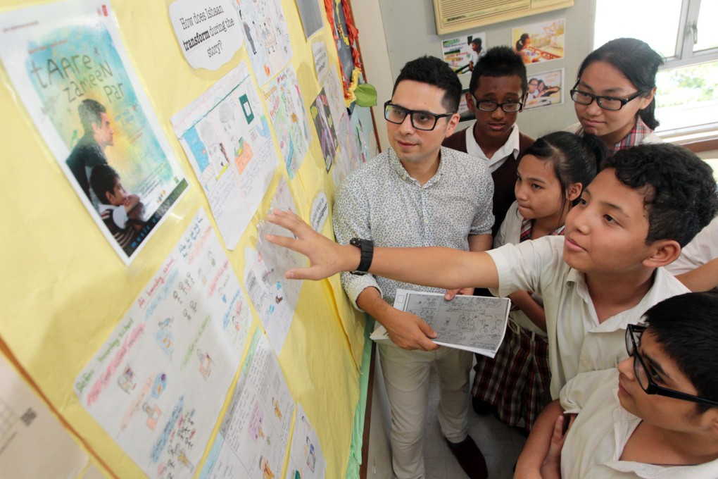 Carlos Soto encourages his students to learn English with the help of Bollywood films. Photo: Felix Wong