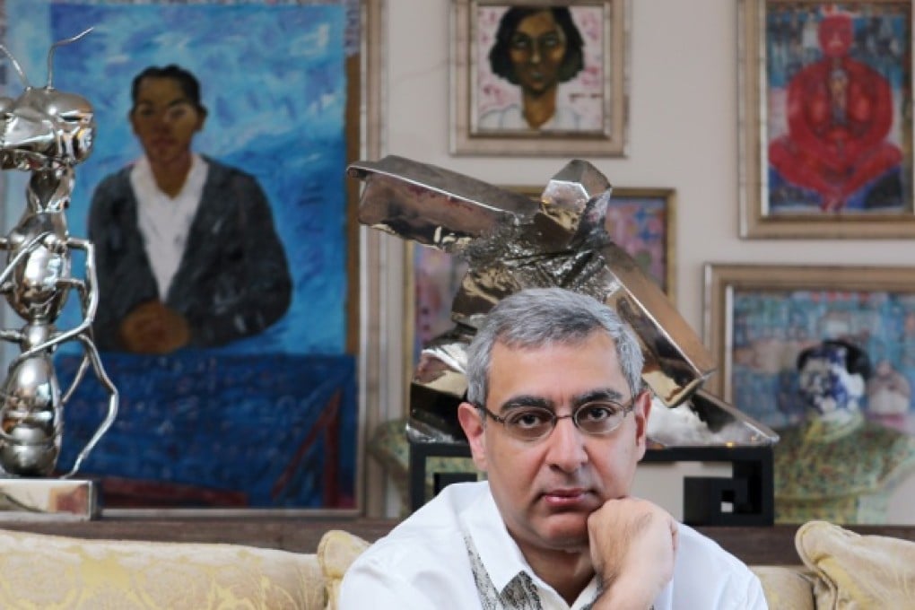 Romnesh Lamba at his home in Central. The paintings are all by Indian artist Arpita Singh. The stainless-steel sculptures (from left to right) are: Ant by Chen Zhiguang and Single Whip by Ju Ming. Photos: K.Y. Cheng
