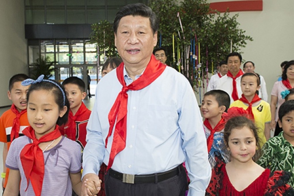 Chinese President Xi Jinping takes part in a children's activity in Beijing on Wednesday. Photo: Xinhua