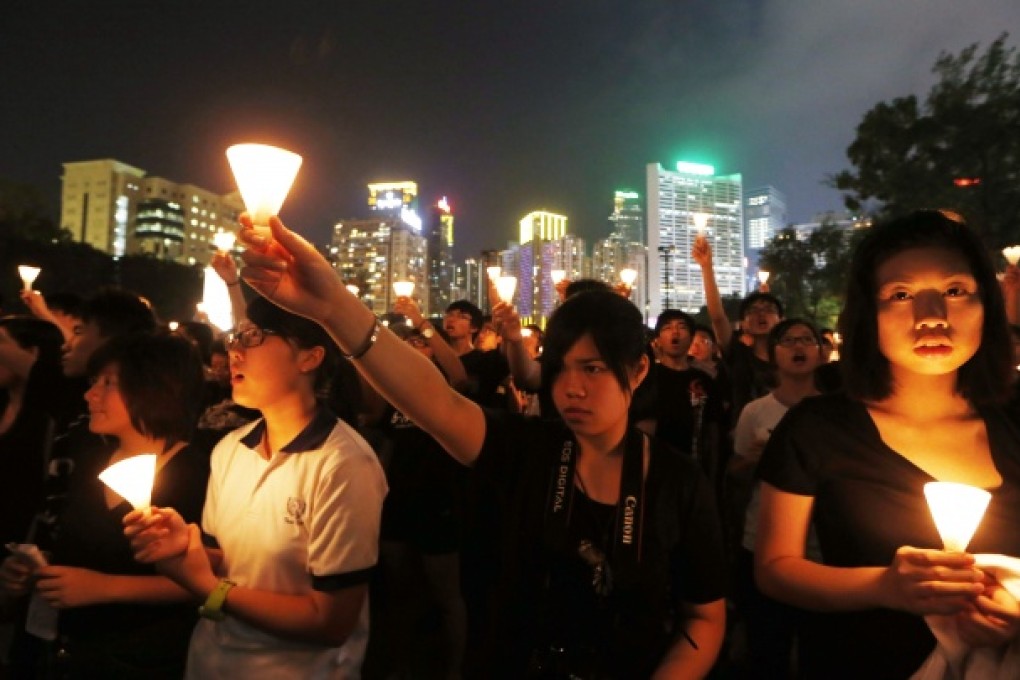 Tens of thousands of people attend a candlelight vigil at Hong Kong's Victoria Park last year. Photo: AP