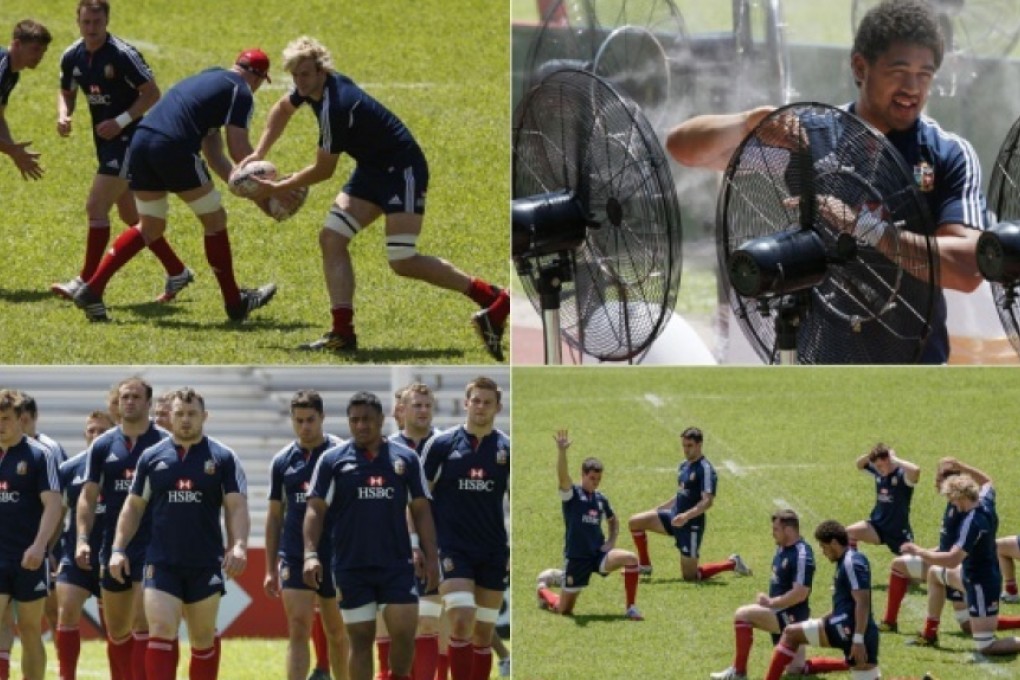 Lions train at Aberdeen Sports Ground yesterday under a hot sun as Toby Faletau takes advantage of the water-spraying fans given to the team to help them keep their cool before their match against the Barbarians at Hong Kong Stadium tonight. Photos: Reuters, AP, AFP