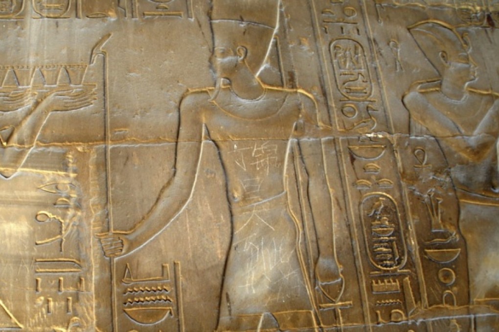 A Nanjing teenager scratched the words 'Ding Jinhao was here' in Chinese characters on a 35-century-old sculpture at the Temple of Luxor in Egypt. Photo: AP