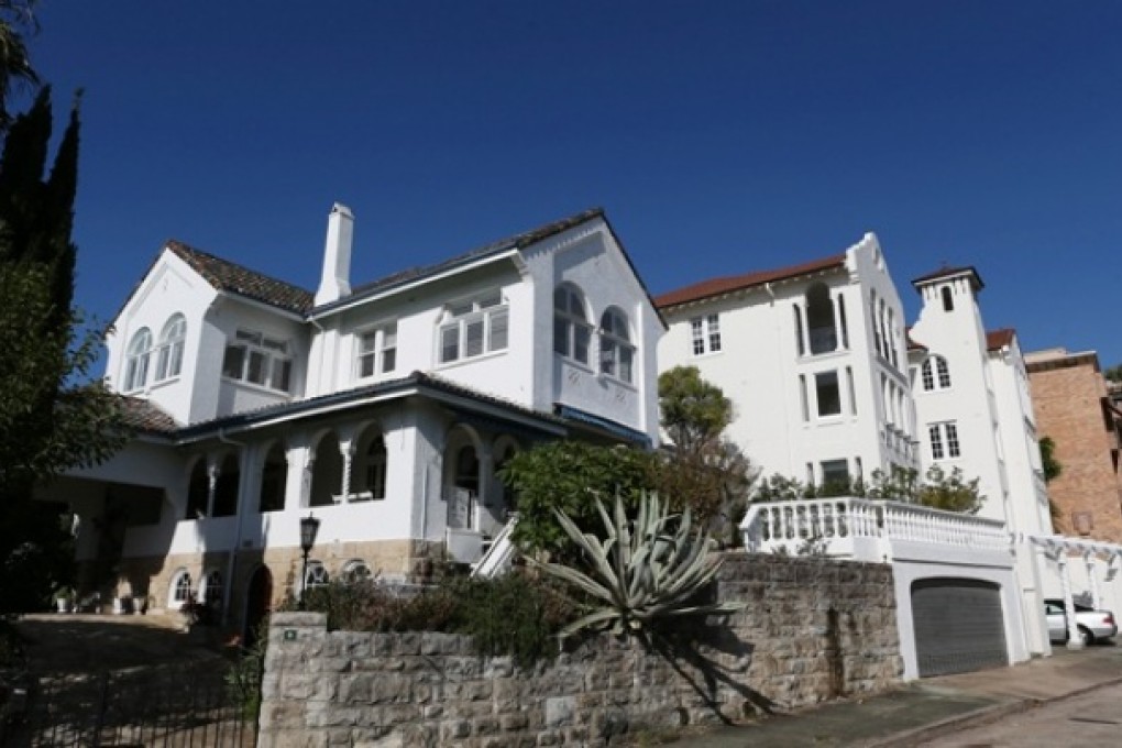 Last month's budget proposed a 10 per cent non-final withholding tax on disposal of Australian residential property by foreign residents for transactions exceeding A$2.5 million. Photo: Bloomberg