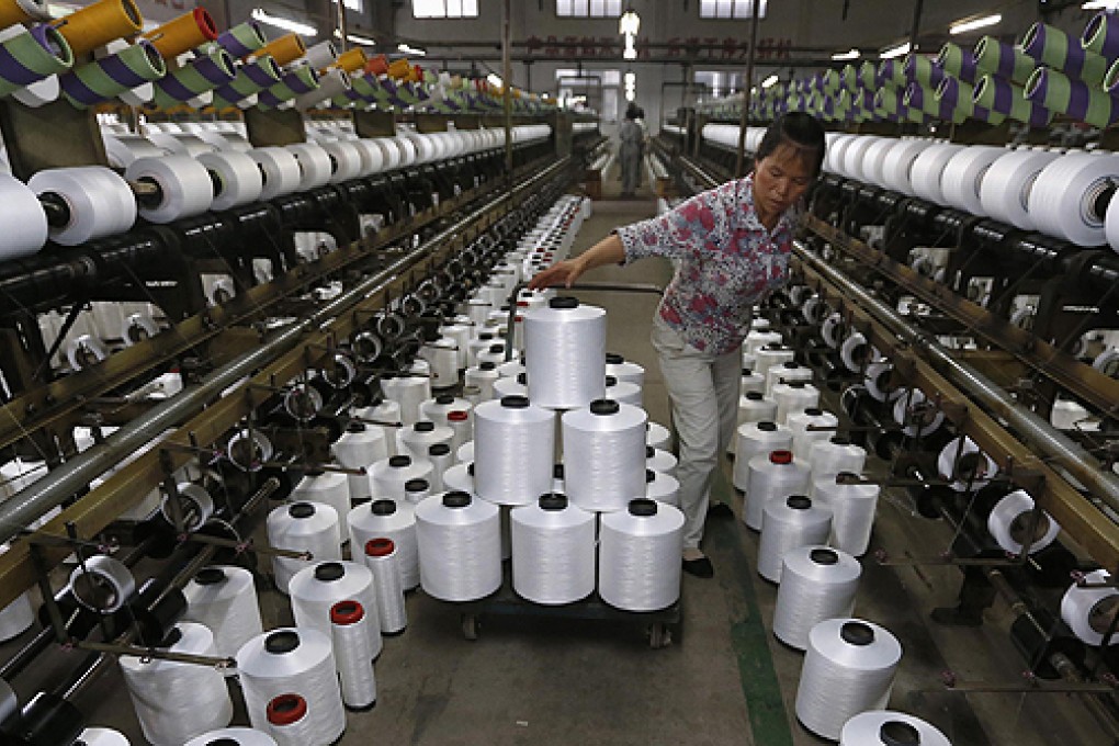 A textile factory in Linhai, Zhejiang province. The PMI reading adds to evidence in recent weeks that China’s economy is losing growth momentum. Photo: Reuters