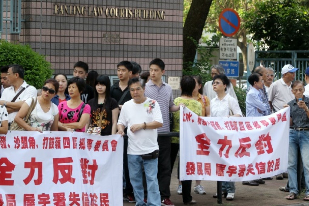 Hau Kwok-cheung - outside Fanling Court - maintains that his house in Kam Tsin village is not subject to a three-storey limit under the small-house policy. Photo: K. Y. Cheng