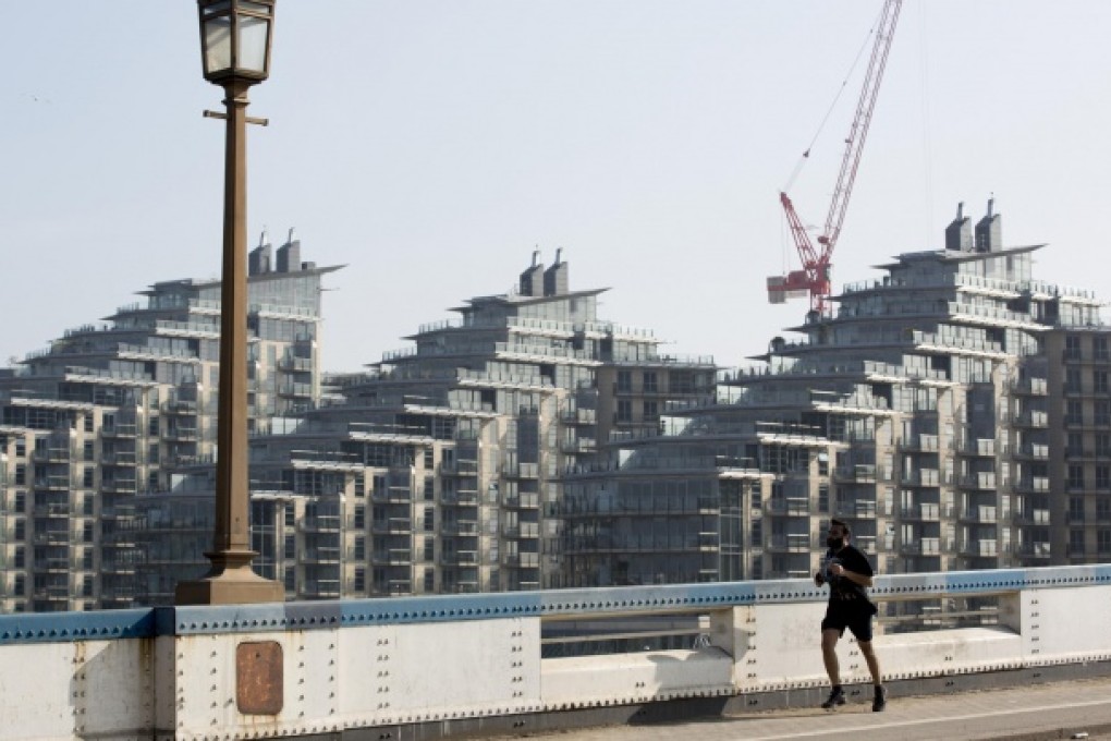A jogger on Wandsworth Bridge in London, where prices stumbled last month, particularly in the high-end market. Photo: Bloomberg