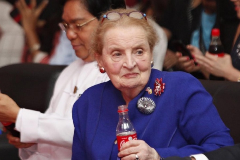 Madeleine Albright holds a Coke during the ceremony. Photo: EPA
