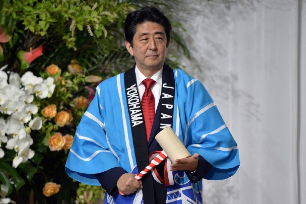 Shinzo Abe is eyeing the private sector to aid growth push. Photo: EPA