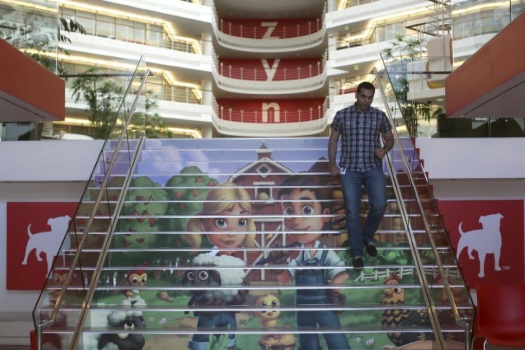 Player avatars from Zynga's FarmVille 2 are seen on a stairway at the entrance to Zynga headquarters in San Francisco. Photo: Reuters
