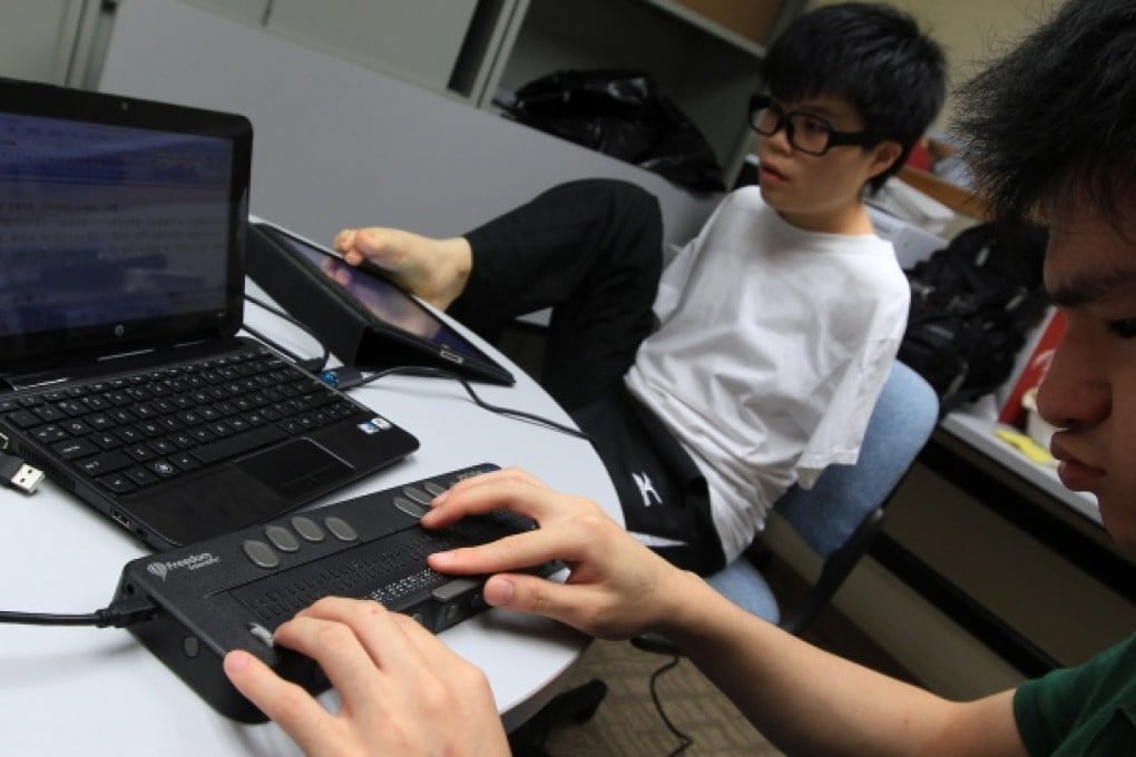 Physically handicapped and visually impaired students demonstrating their E-learning applications. Photo: Jonathan Wong