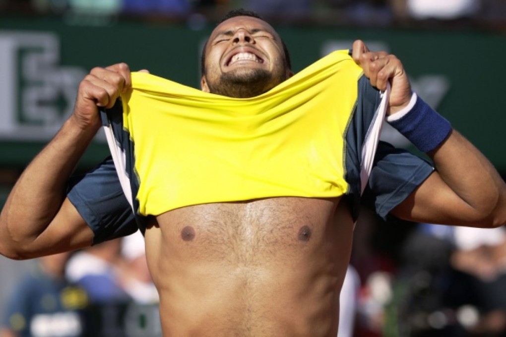 Jo-Wilfried Tsonga celebrates his victory over Roger Federer at the end of their French Open quarter-final. Tsonga now plays David Ferrer for a place in the final. Photo: AFP