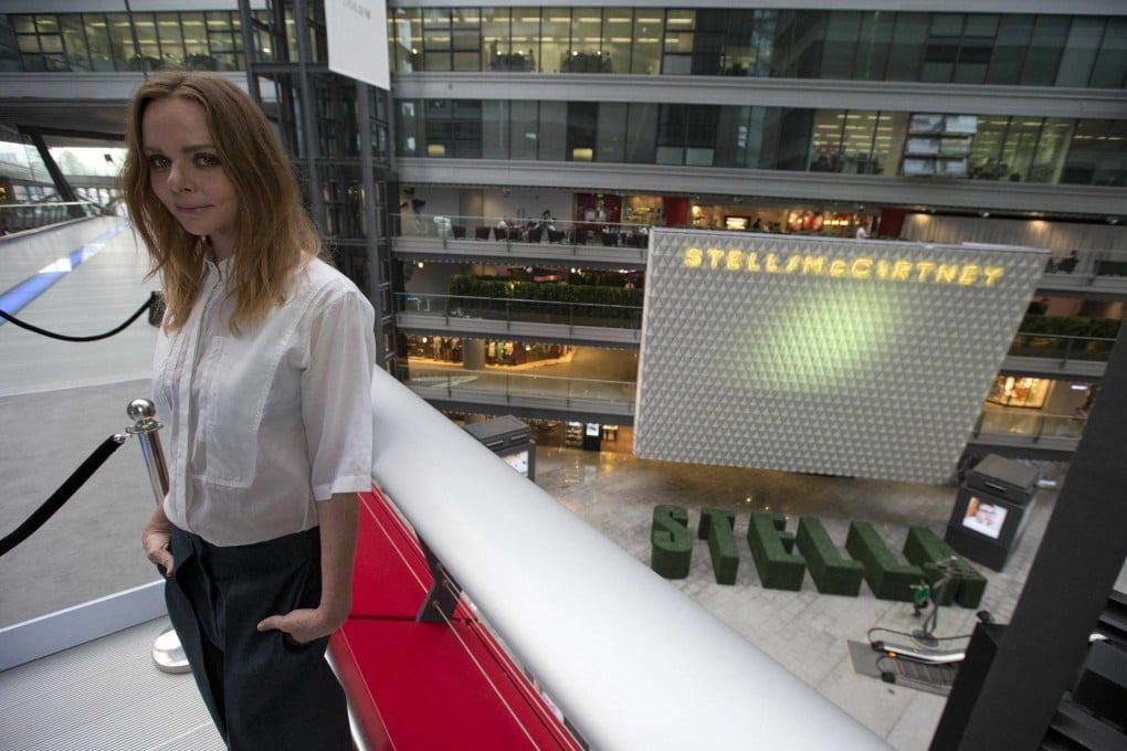 British designer Stella McCartney poses near her flagship store in Beijing. More outlets are being planned on the mainland to add to the firm's first shop in Shanghai. Photo: AP