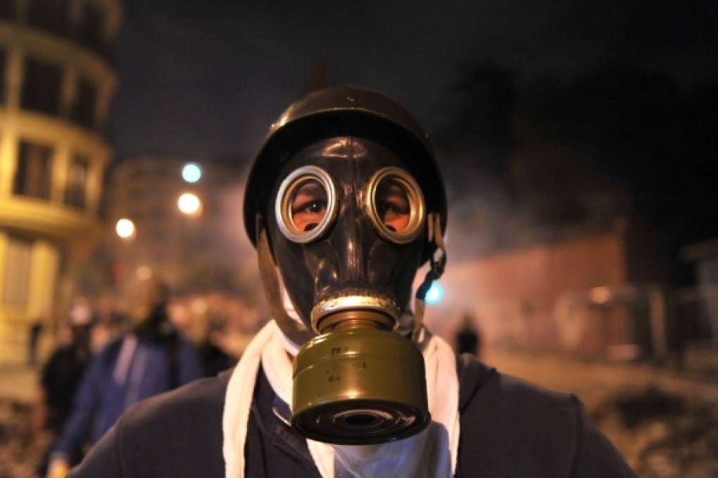A protester wears a gas mask during clashes near Taksim Square in Istanbul on Tuesday. Photo: AFP