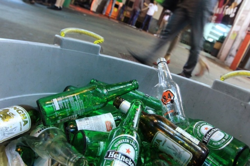 Empty bottles were abandoned outside a bar in Lan Kwai Fong, Hong Kong. The Government earlier this year announced a new levy on glass bottles as parts of a recycling scheme. Photo: Jonathan Wong