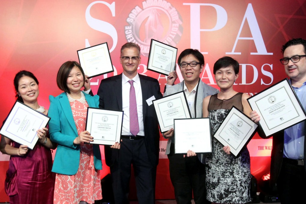 Post prizewinners with managing editor Brian Rhoads (centre) are (from left) Lana Lam, Charlotte So, Denise Tsang, Teddy Ng, Ting Shi and Adolfo Arranz. Photo: Edward Wong