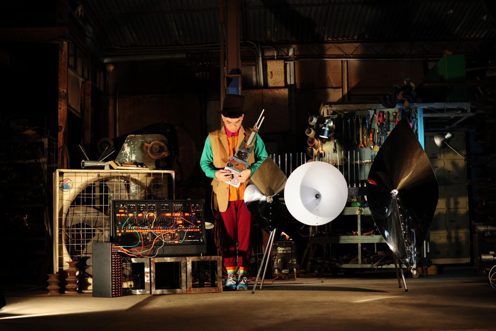 GayBird plays one of his home-made instruments.