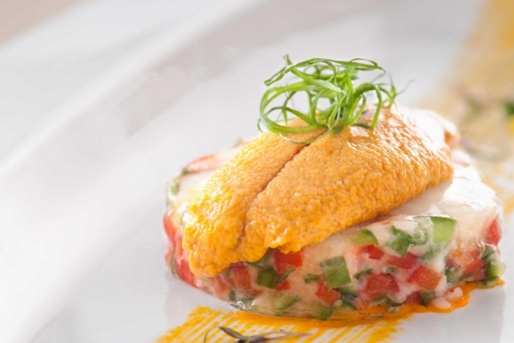 Baked king prawns with sea urchin and black truffles