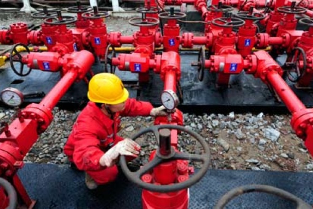 A worker checks the valves in a shale gas plant in China. Photo: Reuters