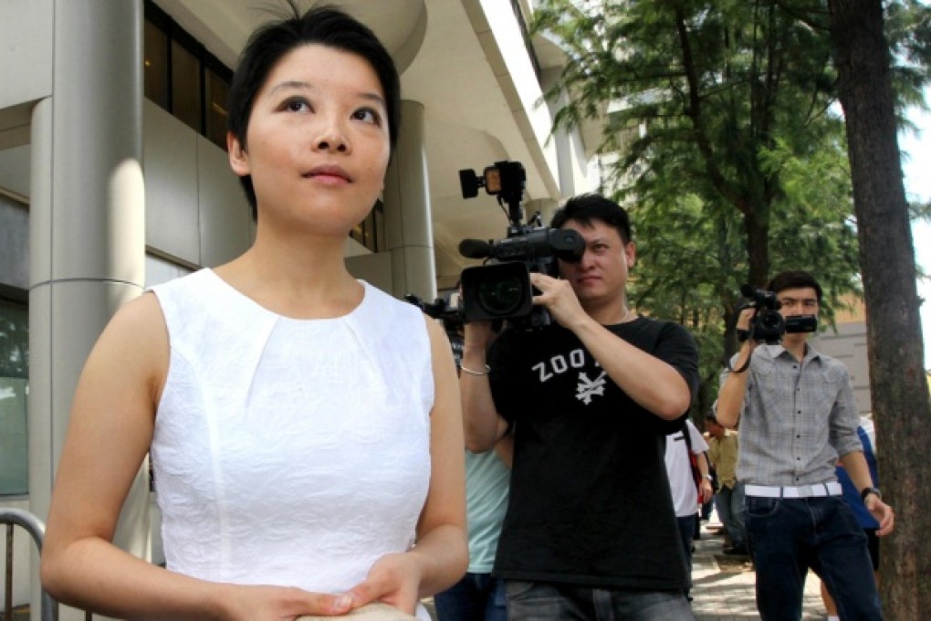 Melody Chan leaves court yesterday after being granted a delay in her trial for her role in a protest two years ago. Photo: Felix Wong