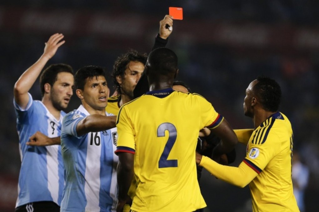 Colombia's Cristian Zapata (2) is shown the red card during the 1-1 draw with Argentina. Photo: AP