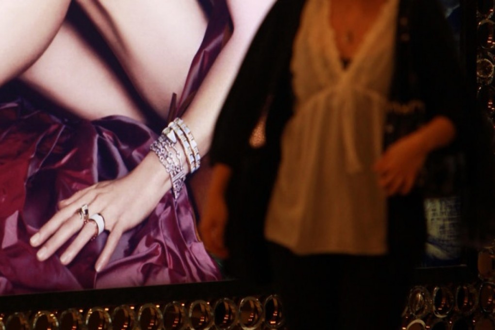 Fashion adverts tempt women to spend. Photo: Jonathan Wong