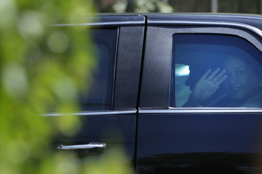 China's first lady Peng Liyuan waves as she leaves. Photo: AP