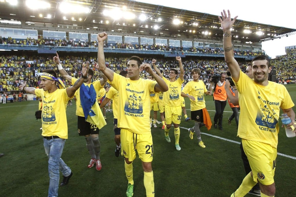 Villarreal players celebrate at El Madrigal stadium in Villarreal, eastern Spain, after their 1-0 win against Almeria on Saturday. Photo: EPA