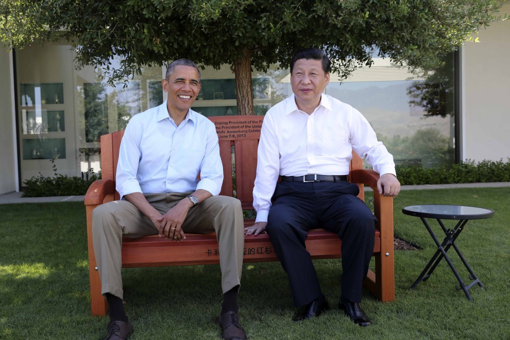 US President Barack Obama presents Chinese President Xi Jinping with a bench made of California redwood, as they take a joint walk before heading into their second meeting. Photo: Xinhua