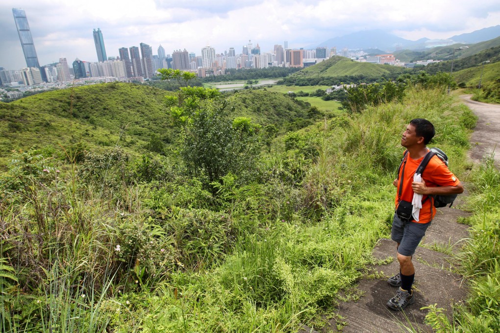 A hiker admires the view and greenery at Lok Ma Chau, part of the restricted zone the government is now opening up. Photo: Dickson Lee