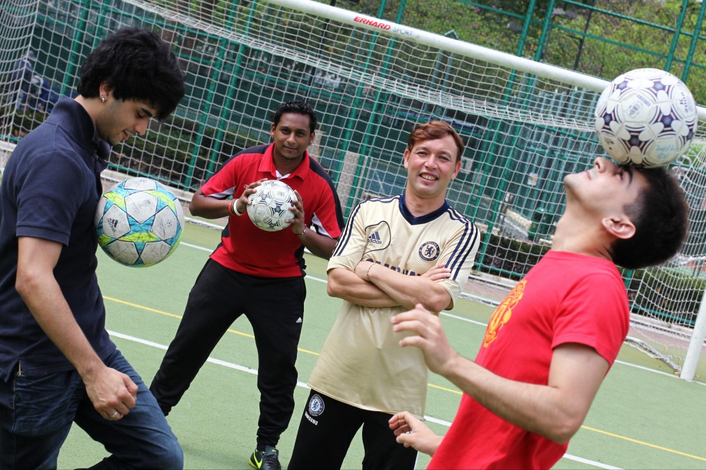 (From left) Leslie Santos, who sat the coaching exam in English, and Mohammad Wahid, Jeffrey Andrews and Abdul Aziz, who were offered a Chinese version only. Photo: Nora Tam