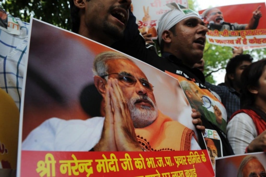 Modi supporters cheer his election role. Photo: AFP