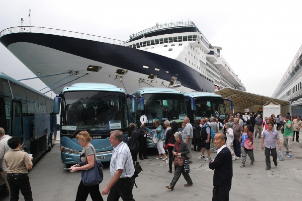 Passengers disembark from the Celebrity Millennium at Kai Tak, when it docked at the terminal during a trial run in March. Photo: Felix Wong