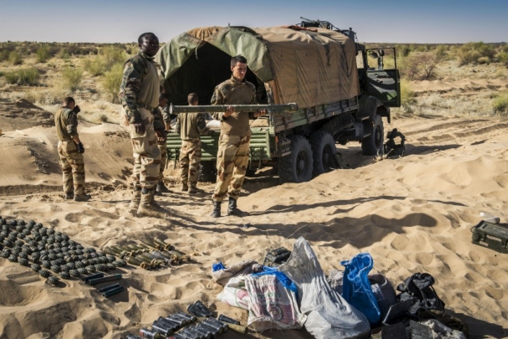 A French soldier holds an SA-7 launch tube near Timbuktu. Photo: AP