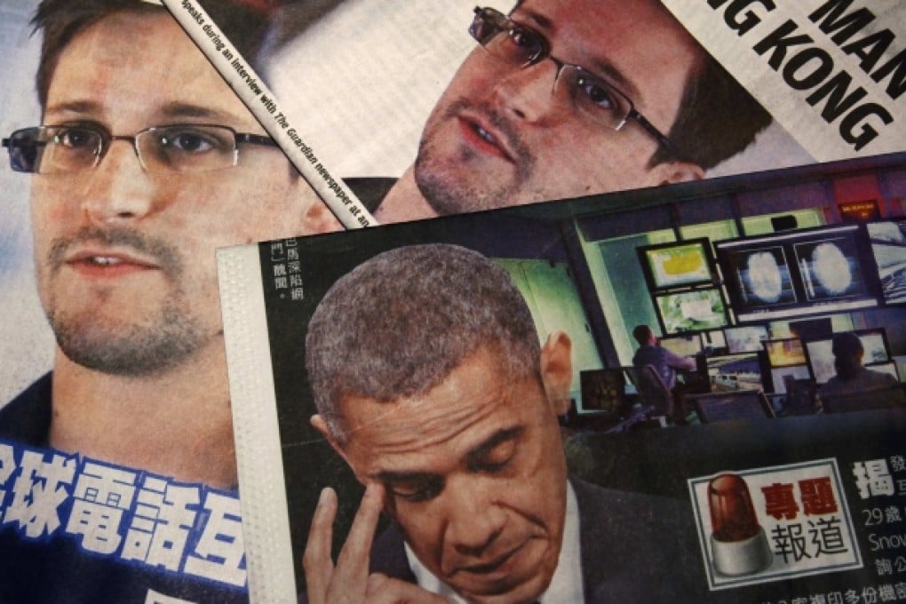 Photos of US whistleblower Edward Snowden and President Obama are printed on the front pages of local English and Chinese newspapers in Hong Kong. Photo: Reuters