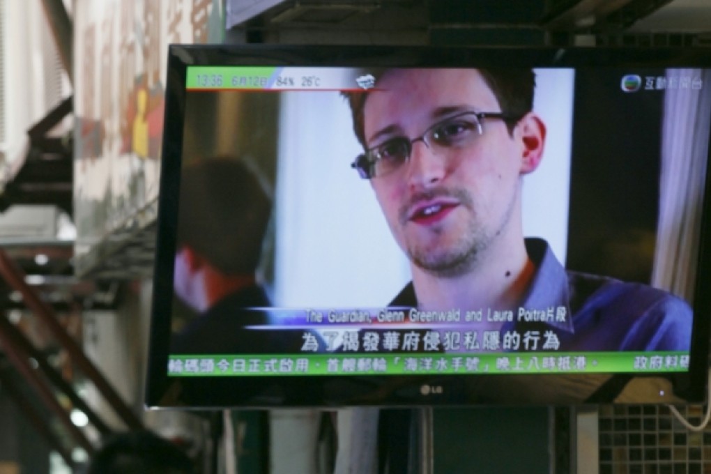 A TV screen shows the news of Edward Snowden at a restaurant in Hong Kong. Photo: AP