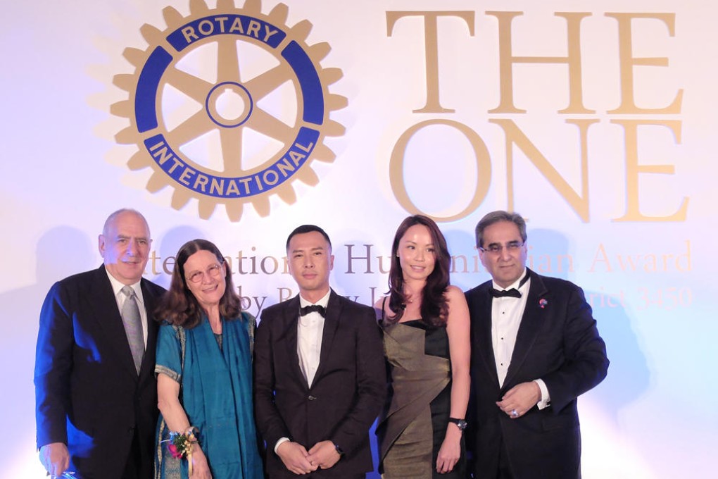 Award recipient Valerie Ann Taylor (second from left) with Richard Elman (left), Donnie Yen Ji-Dan, Roraine Tang and David Harilela (right) at The One International Humanitarian Award 2013 gala dinner.