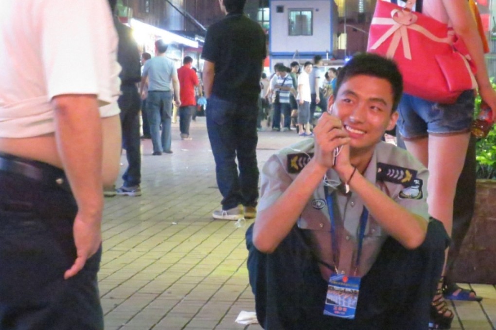 Put a sock in it: one of Shenzhen's finest, rushed off his feet. Photo: Cecilie Gamst Berg